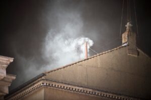 White smoke pluming out of the Sistine Chapel